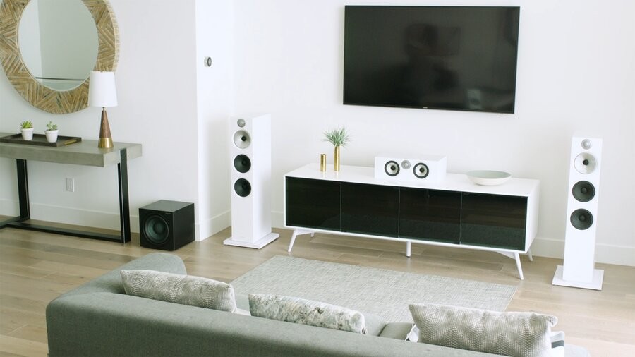 Bowers & Wilkins luxury speakers as part of a home audio system in a living space.
