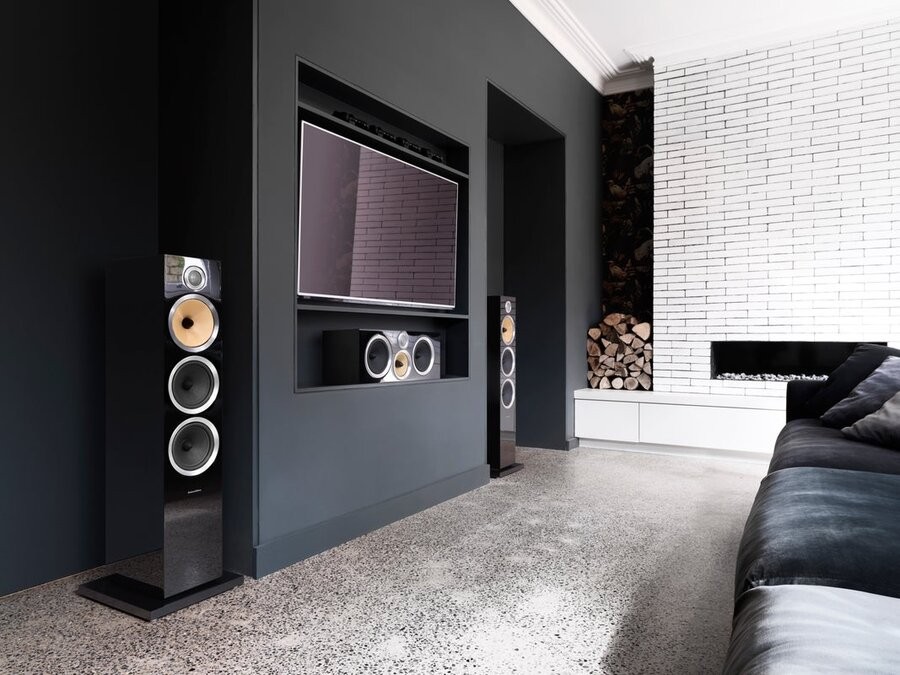 A media room setup featuring speakers from Bowers & Wilkins.
