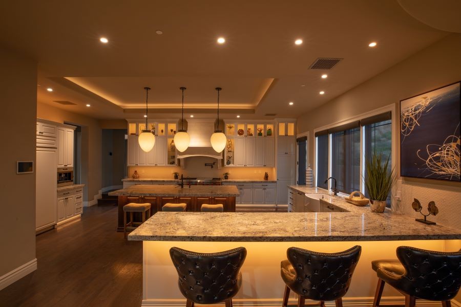 A warm-lit kitchen with various fixtures and Control4 LED linear lighting.